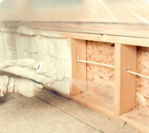 spray foam installer, installing spray foam inside home's walls.