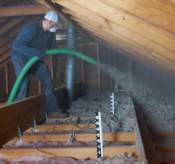 Cellulose Insulation Installer, in customer's attic.
