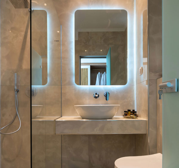 Floating mirror installed in a home's bathroom.