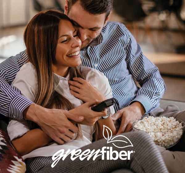 Couple at home enjoying the benefits of an insulated home.